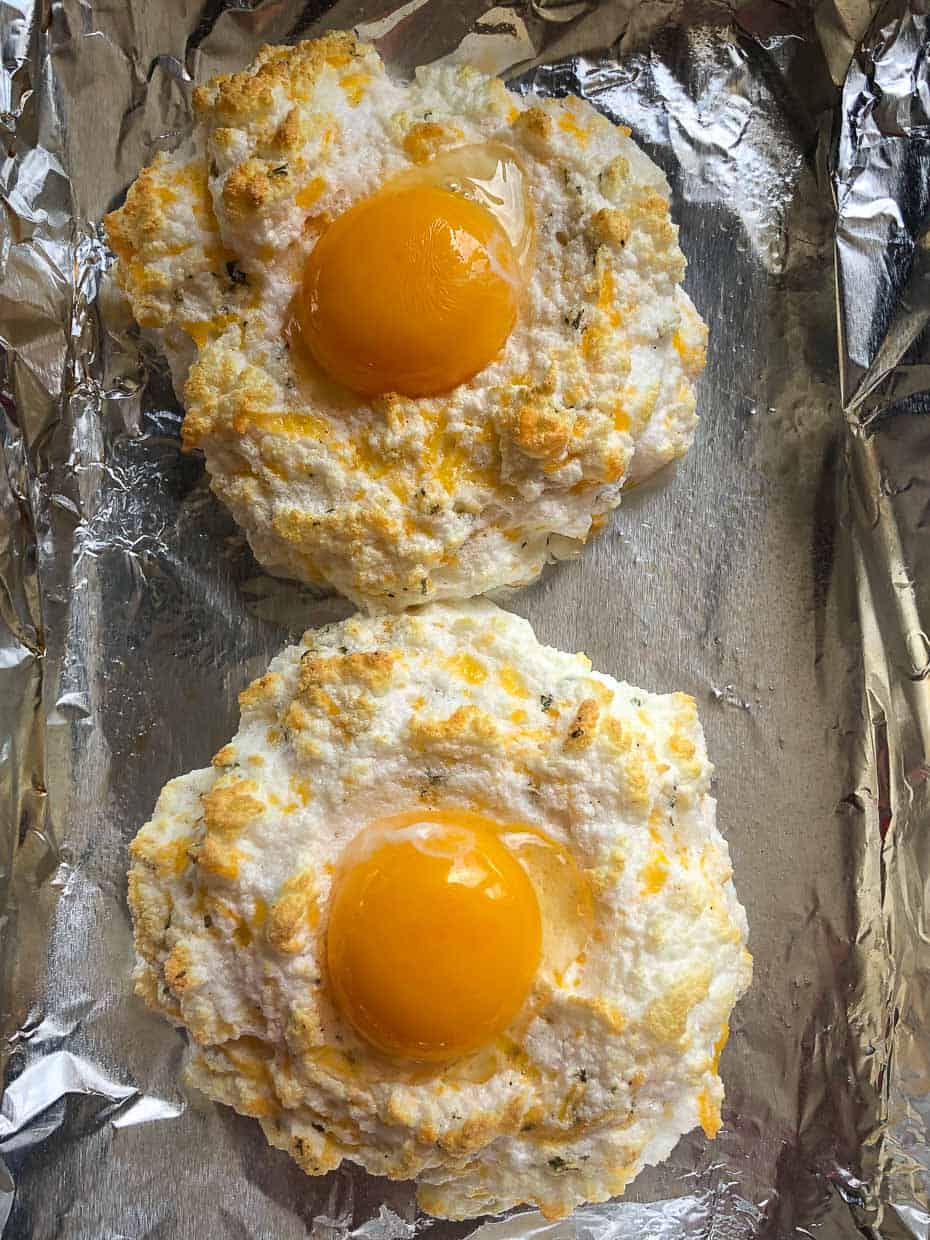 Cheddar bay egg fluffs topped with egg yolk added to each overhead shot