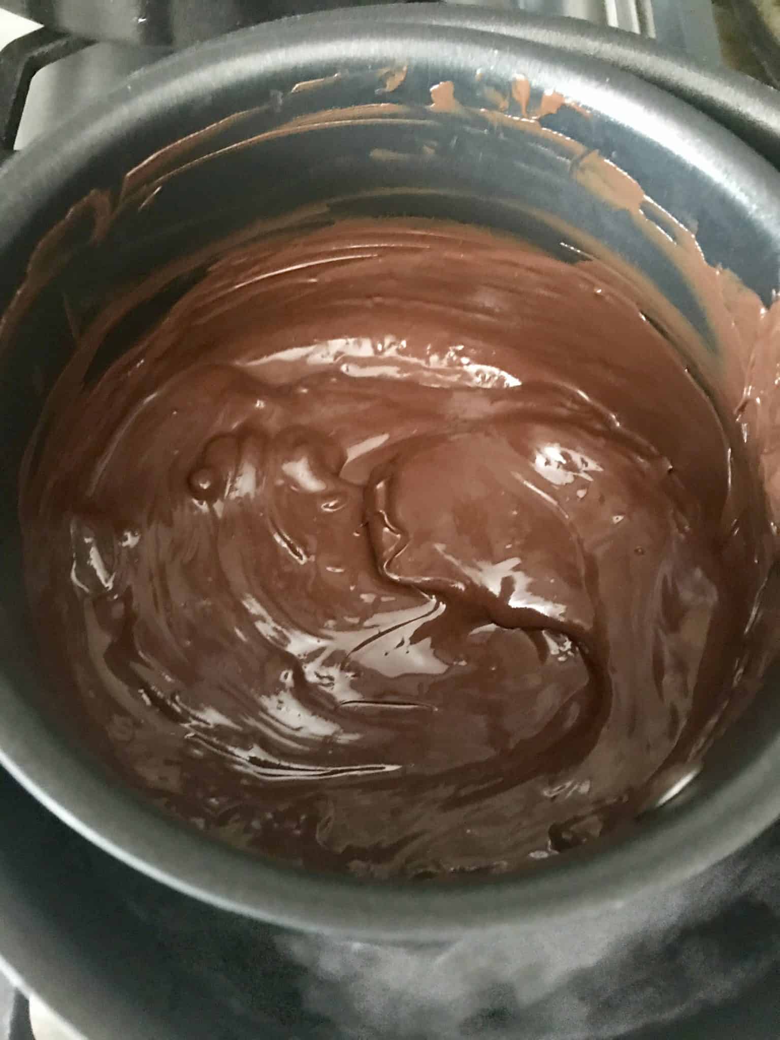 Melted Chocolate in double boiler pot overhead shot
