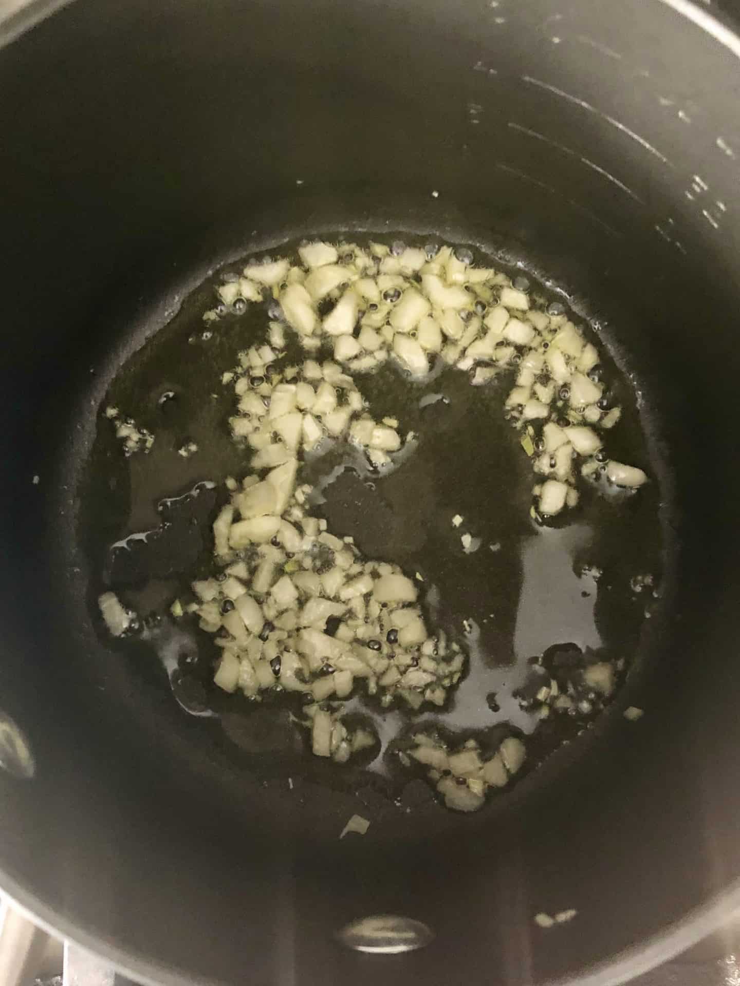 Garlic sautéing in pot