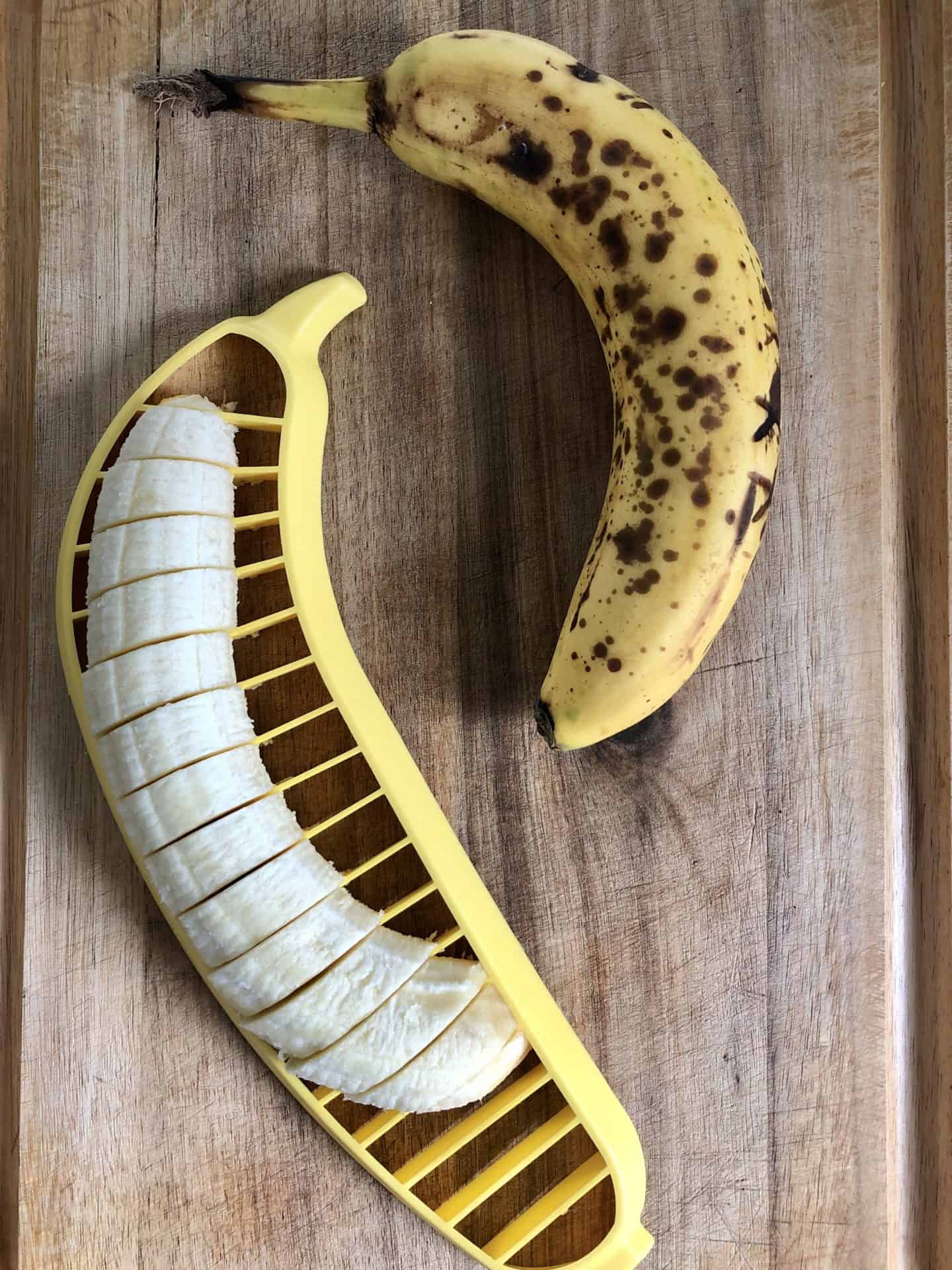 Bananas being sliced with a banana slicer