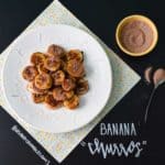 Banana Churros on white plate with title written on chalkboard