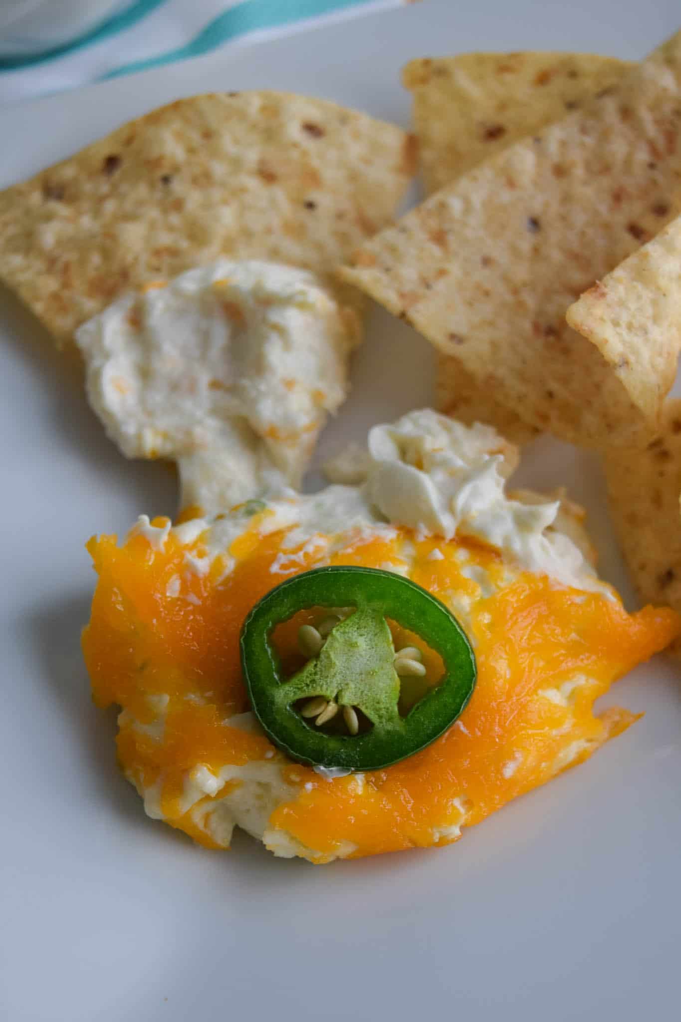 skinny jalapeno pepper dip served on plate with tortilla chips