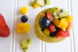 tropical fruit salad in kiwi cups old image