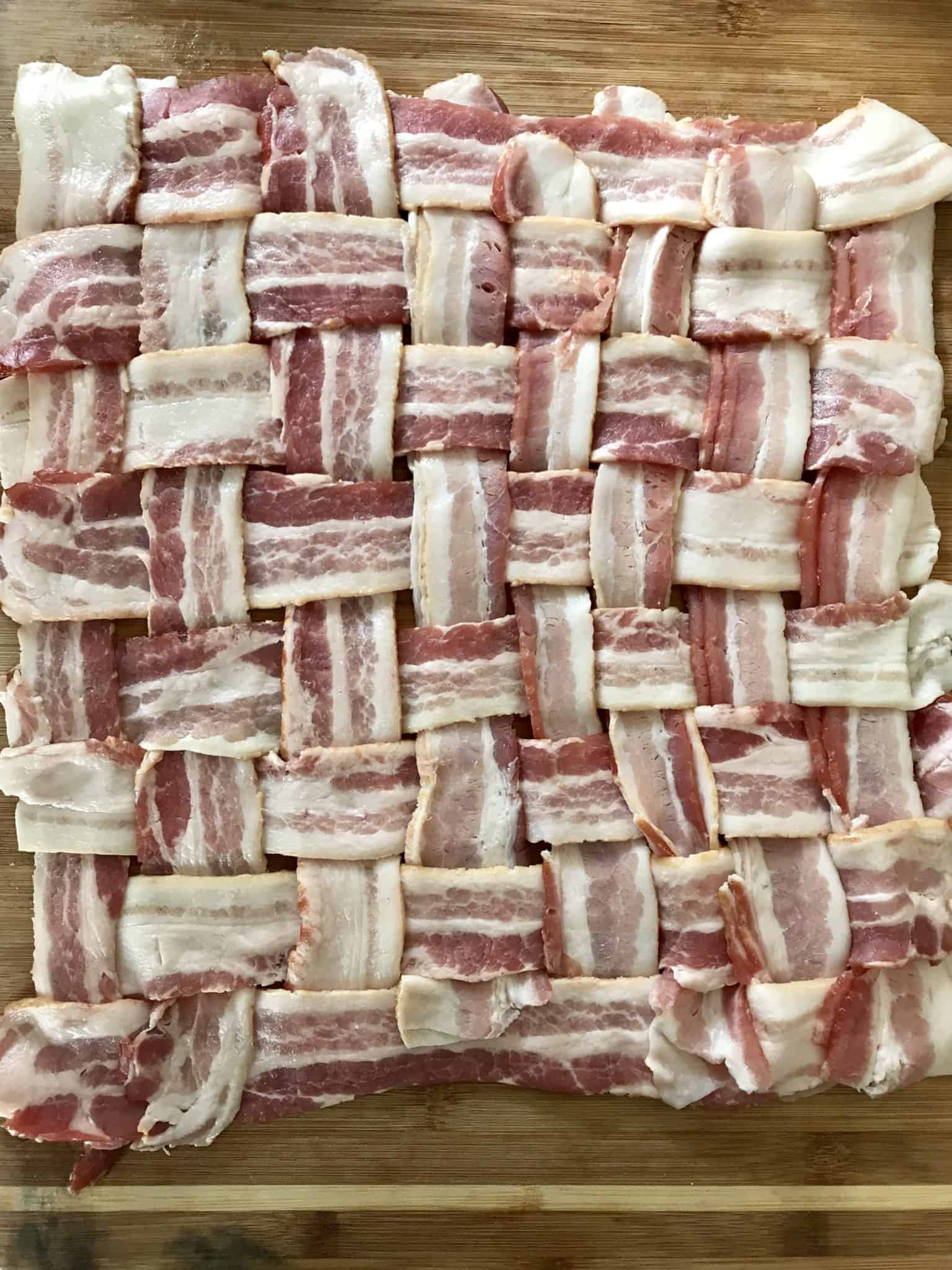 Bacon weave on wooden cutting board overhead shot