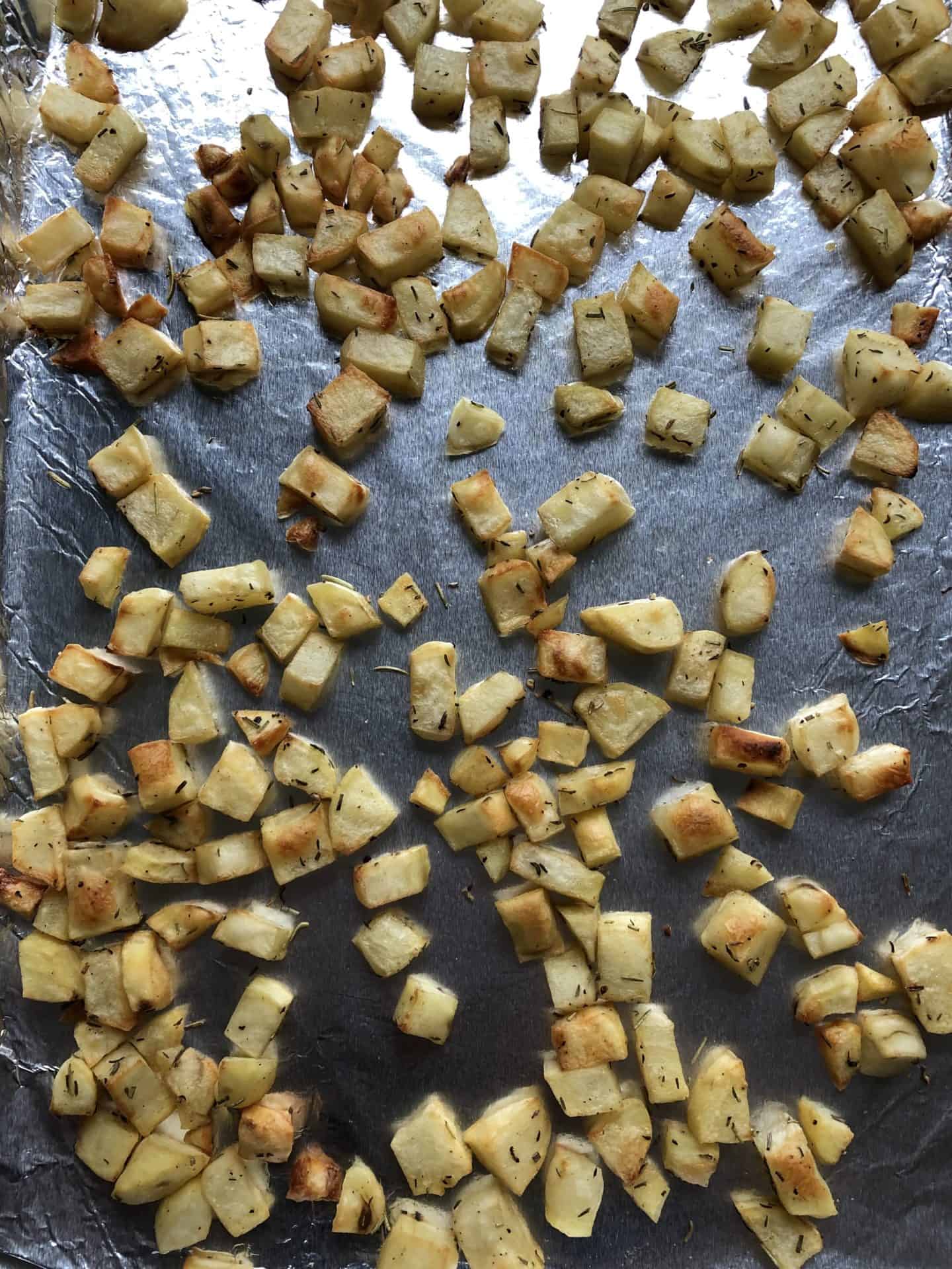 diced potatoes cooked on baking sheet 