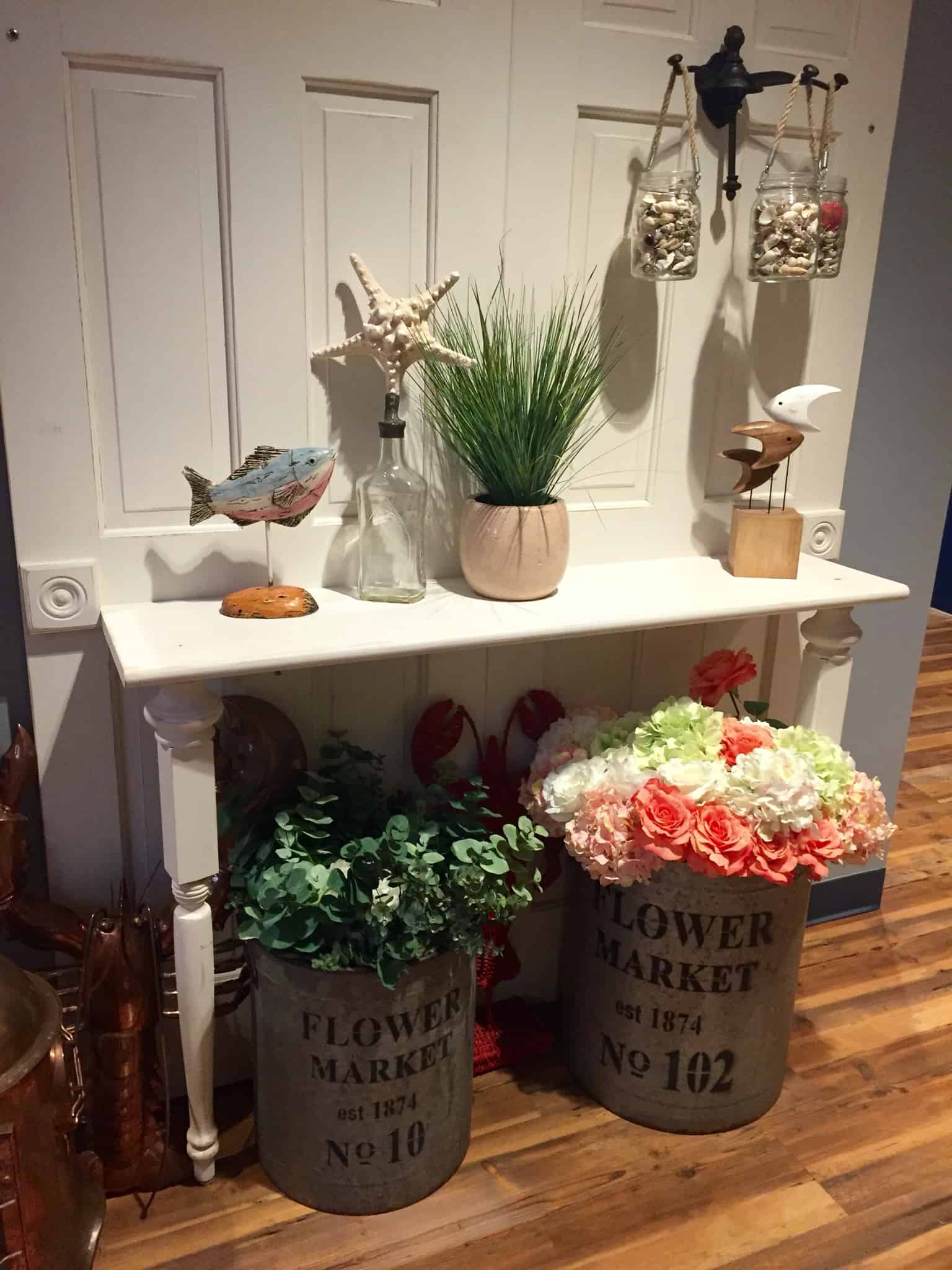 The Claw House Restaurant entryway table with various nautical decor