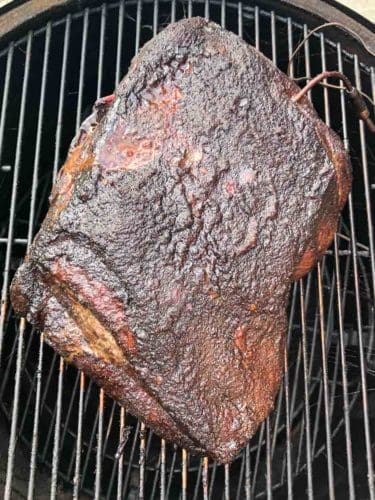 Smoked pork butt on weber grill overhead shot