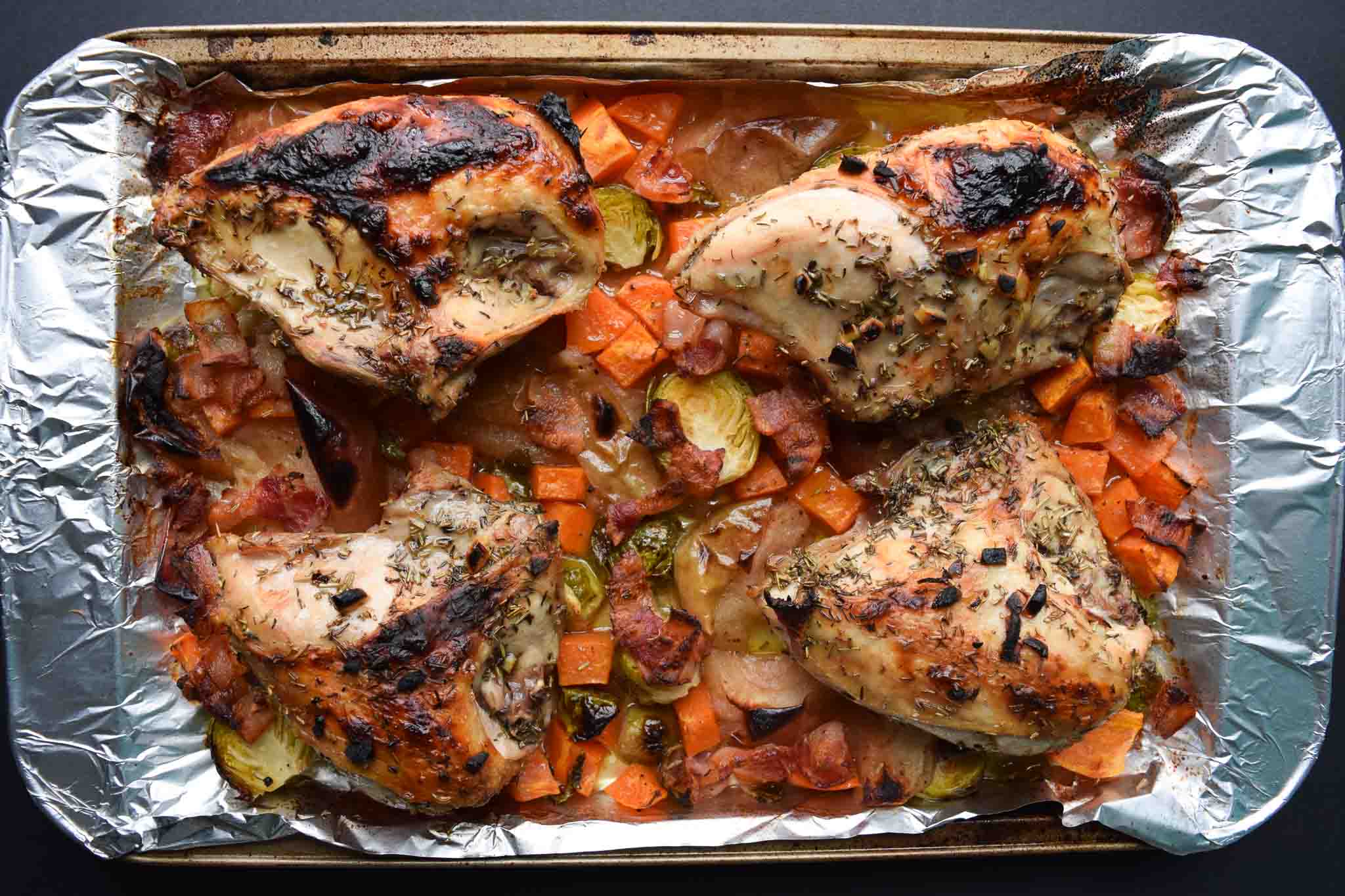 one pan harvest chicken cooked on baking sheet overhead shot