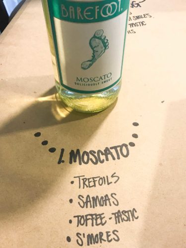 bottle of moscato on brown paper with cookie pairings written underneath