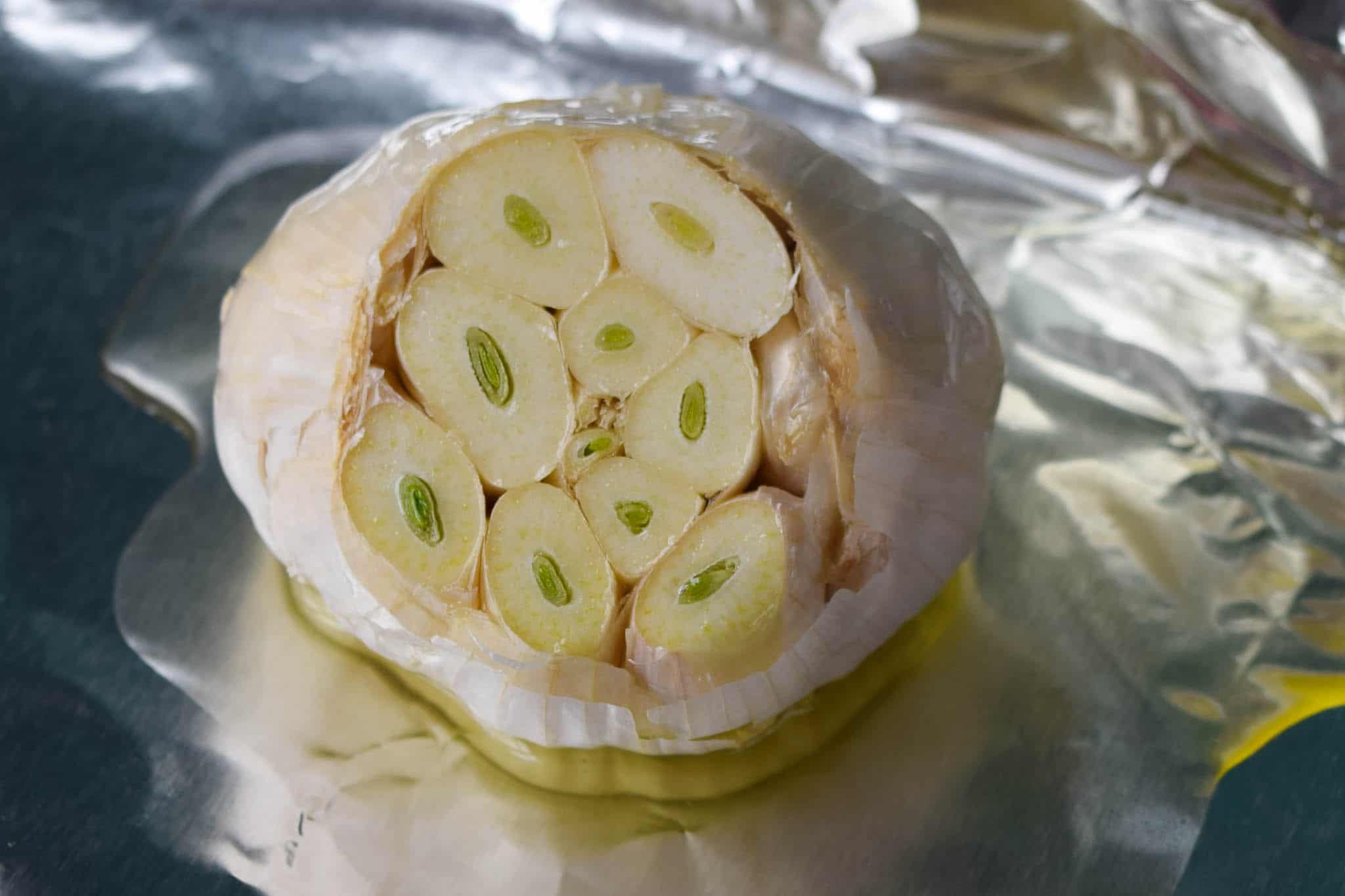 head of garlic with top sliced off 