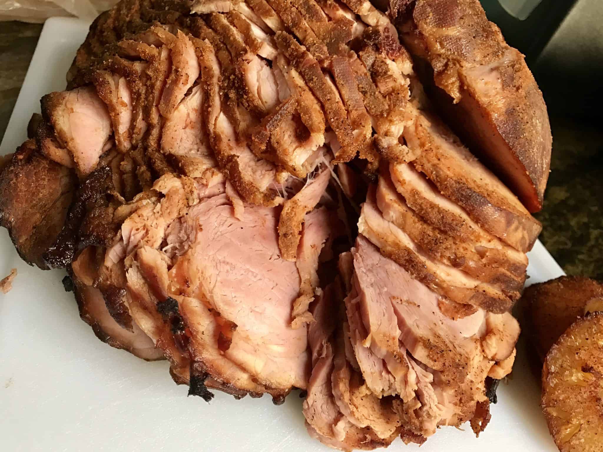 bbq smoked ham sliced and ready to be served close up view