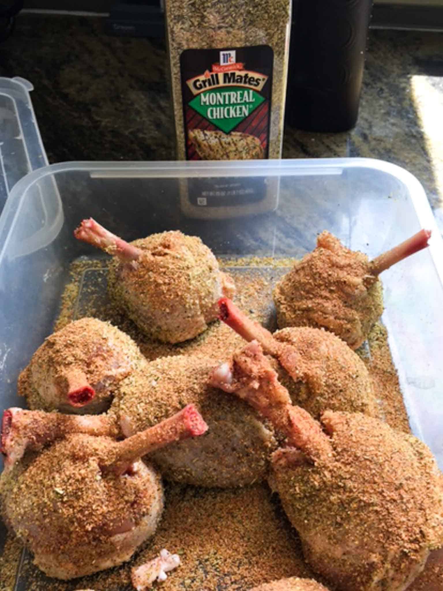 Chicken Lollipops in Tupperware container seasoned liberally with Montreal seasoning