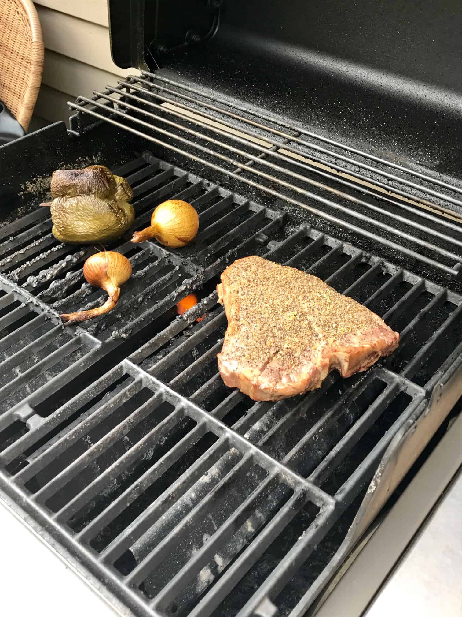 Steak on grill grates side view