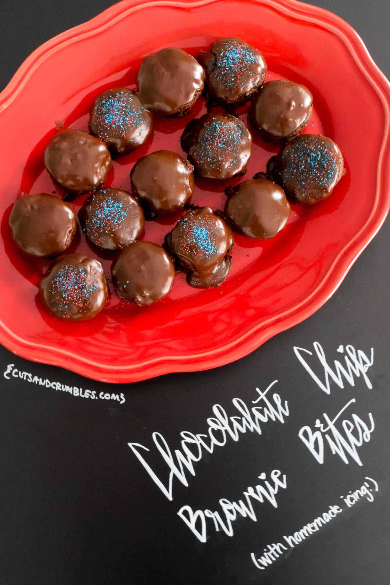 Chocolate Chip Brownie Bites with Homemade Icing on red platter with title written on chalkboard