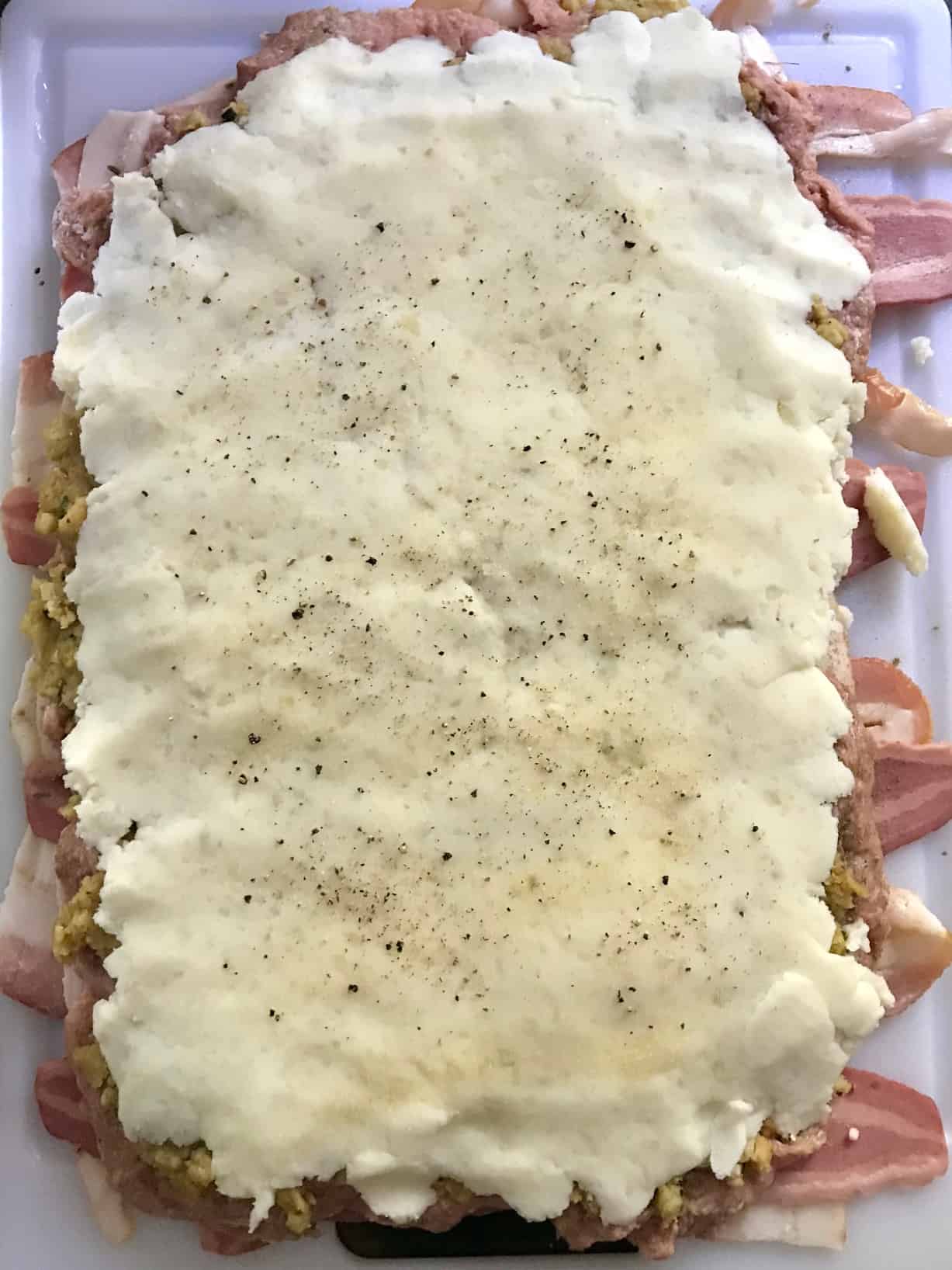 Bacon weave covered with mashed potatoes overhead shot