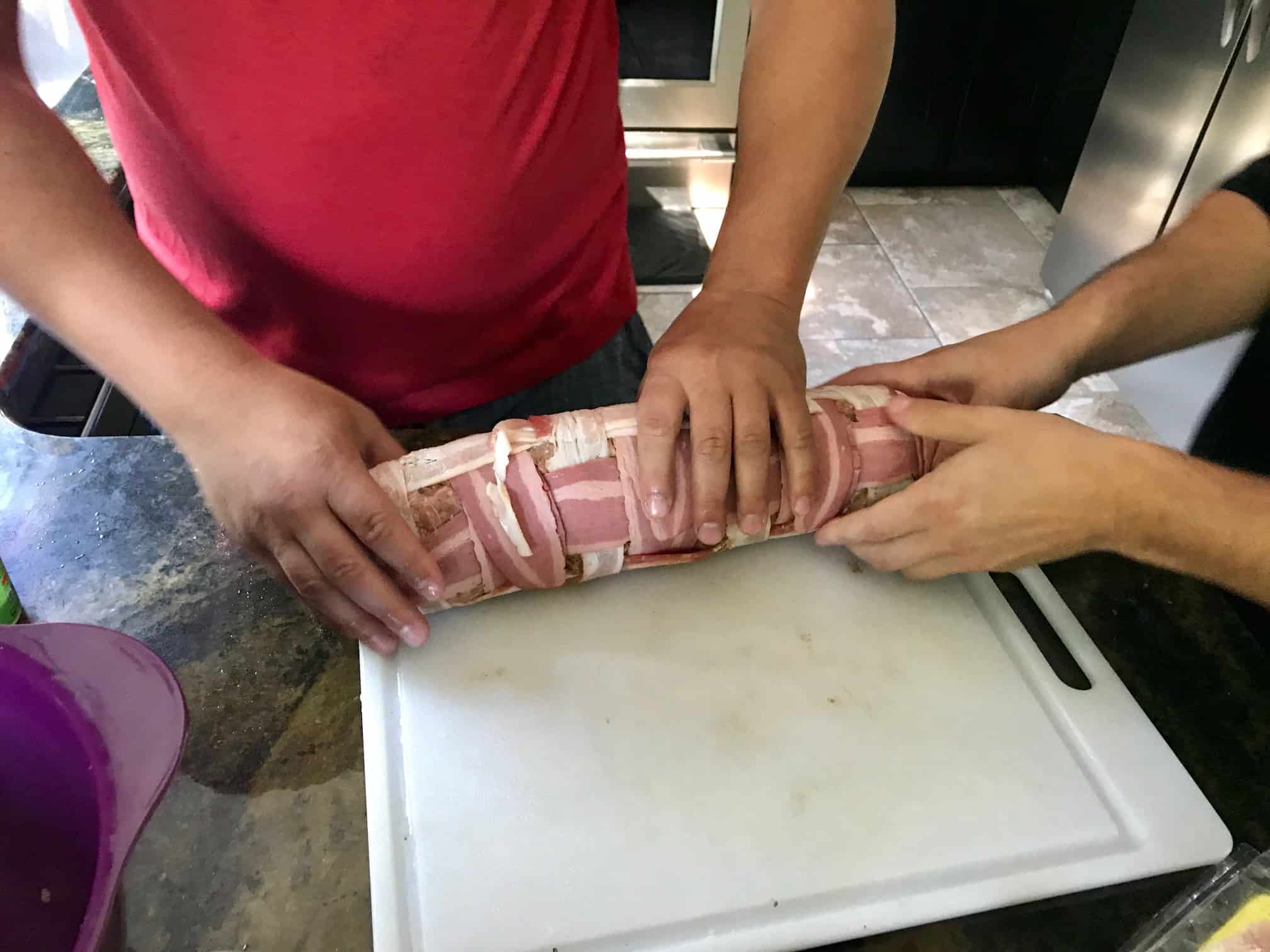 Rolling up bacon explosion process