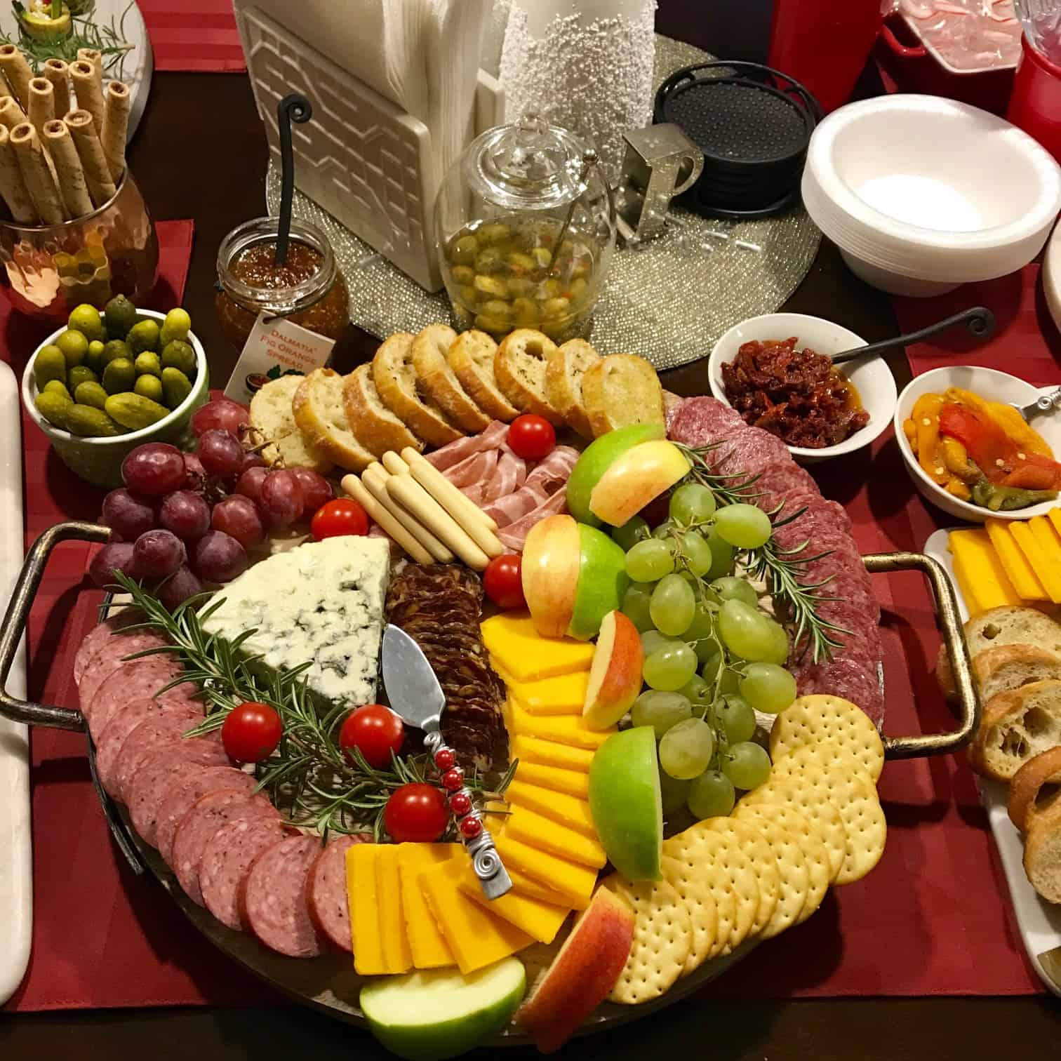 Holiday Cheese Board with bowls of various accompaniments around it