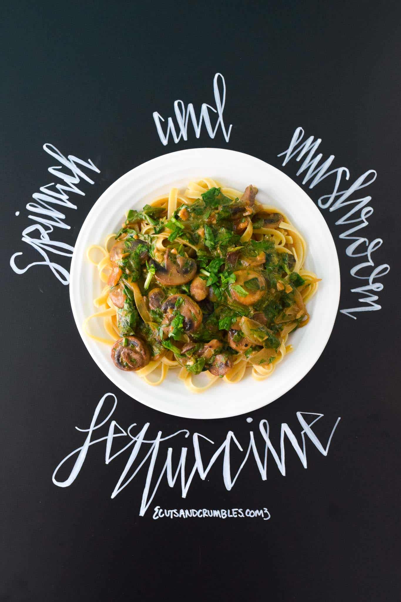Spinach and Mushroom Fettuccine with title written on chalkboard