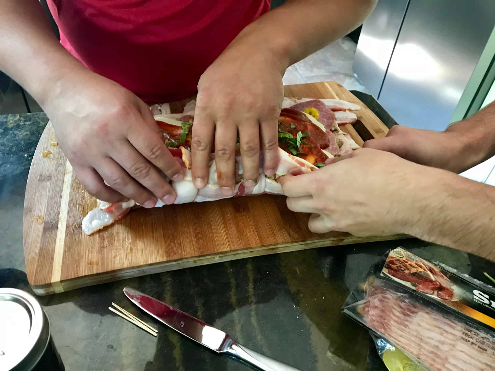 Pizza Bacon Explosion being rolled up side view