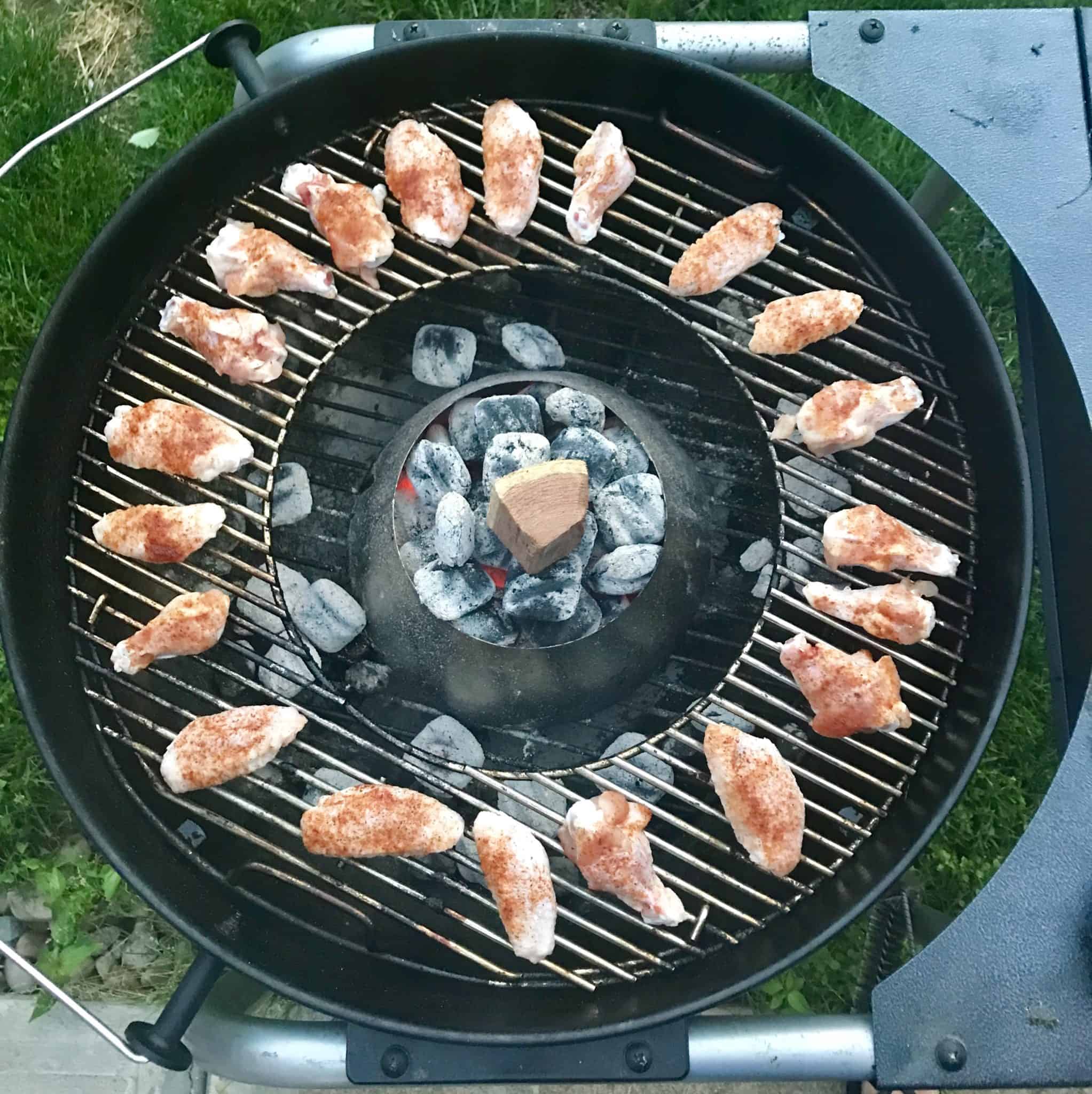 Chicken wings on weber grill with vortex in center overhead shot