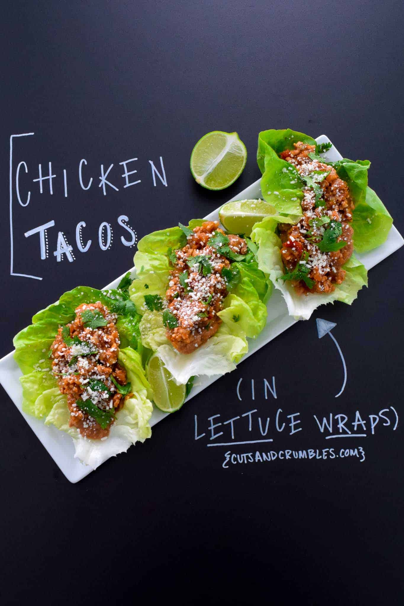 Chicken Tacos in Lettuce Wraps with title written on chalkboard