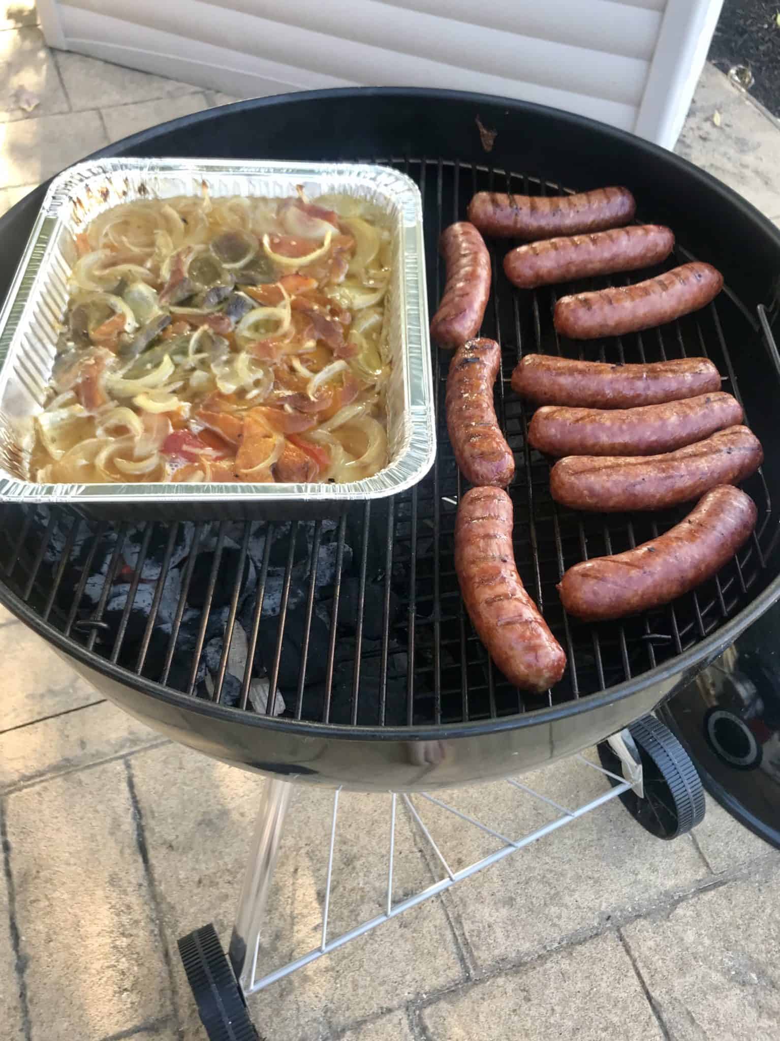 Sausage and Peppers cooked on weber grill side view 