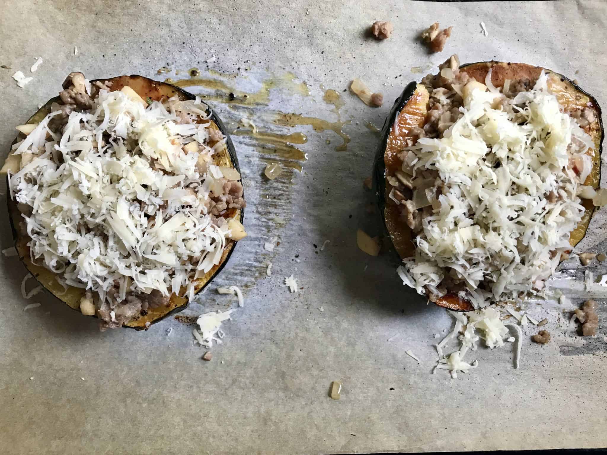 Acorn Squash stuffed and topped with shredded gruyére cheese