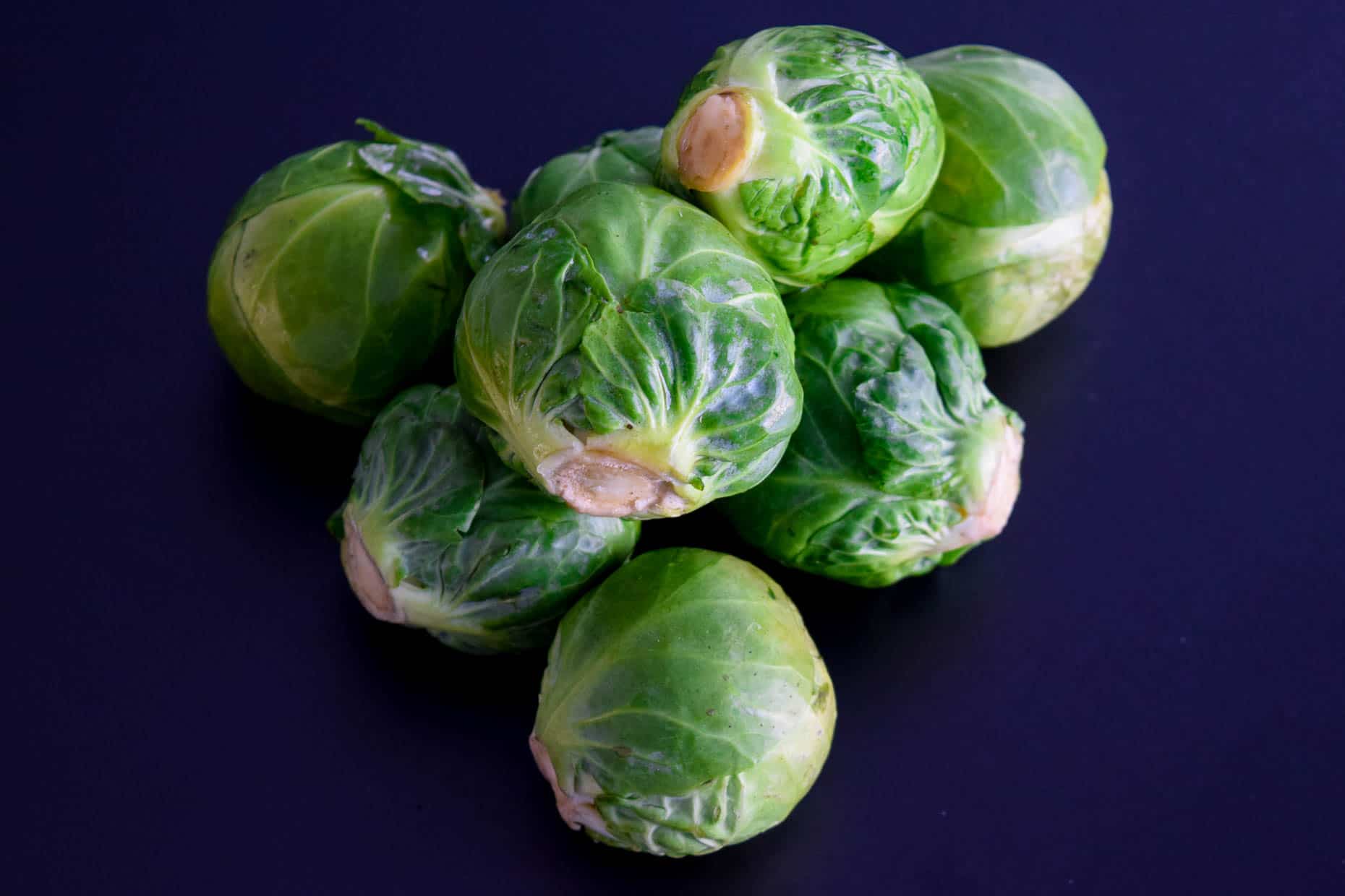 Brussels sprouts on black background