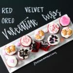 Red Velvet Oreo Valentine Cups on white platter with chalkboard writing