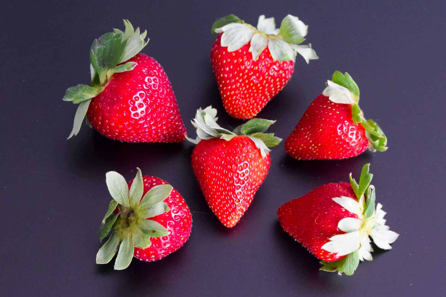 Strawberries on black background