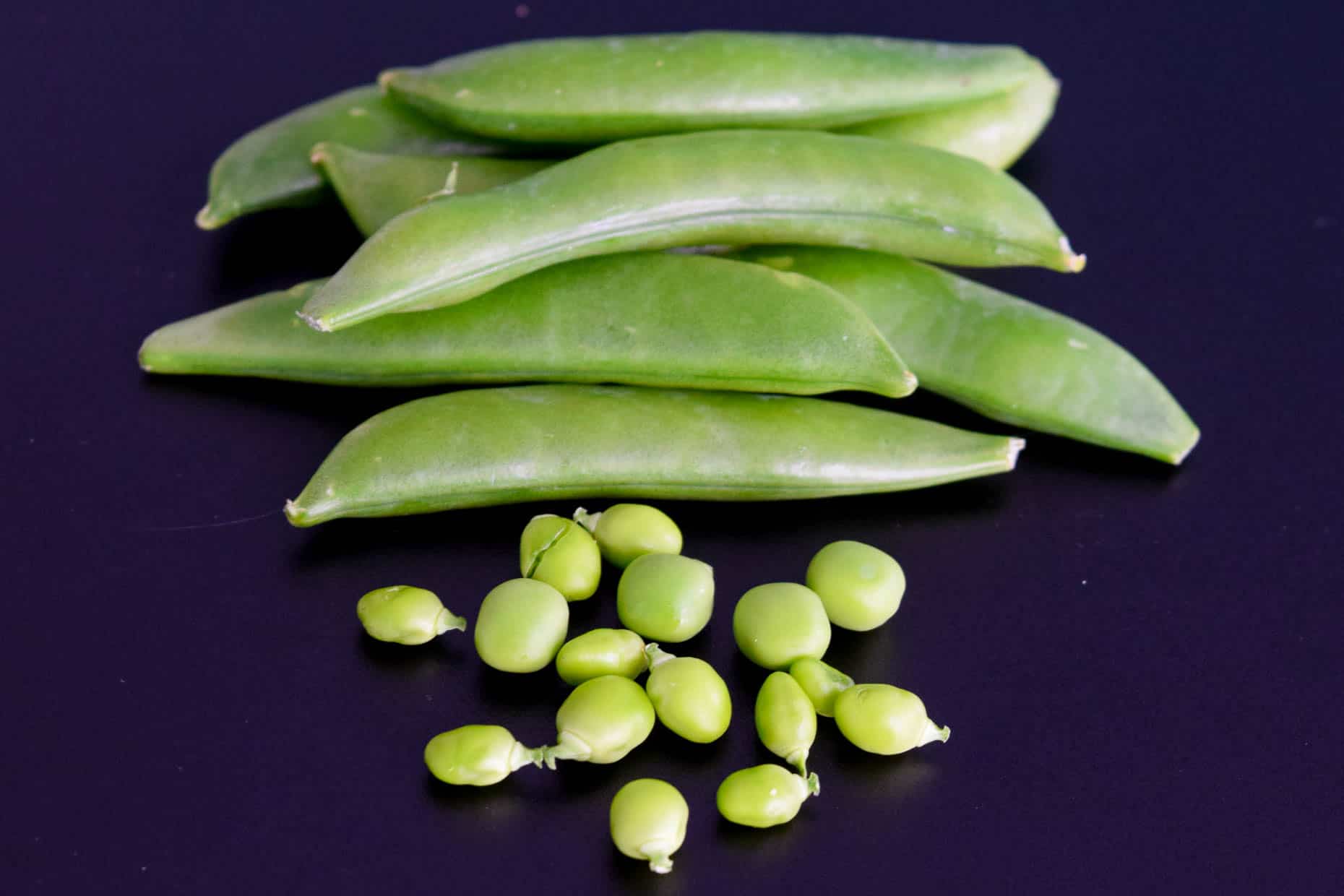 Peas on black chalkboard