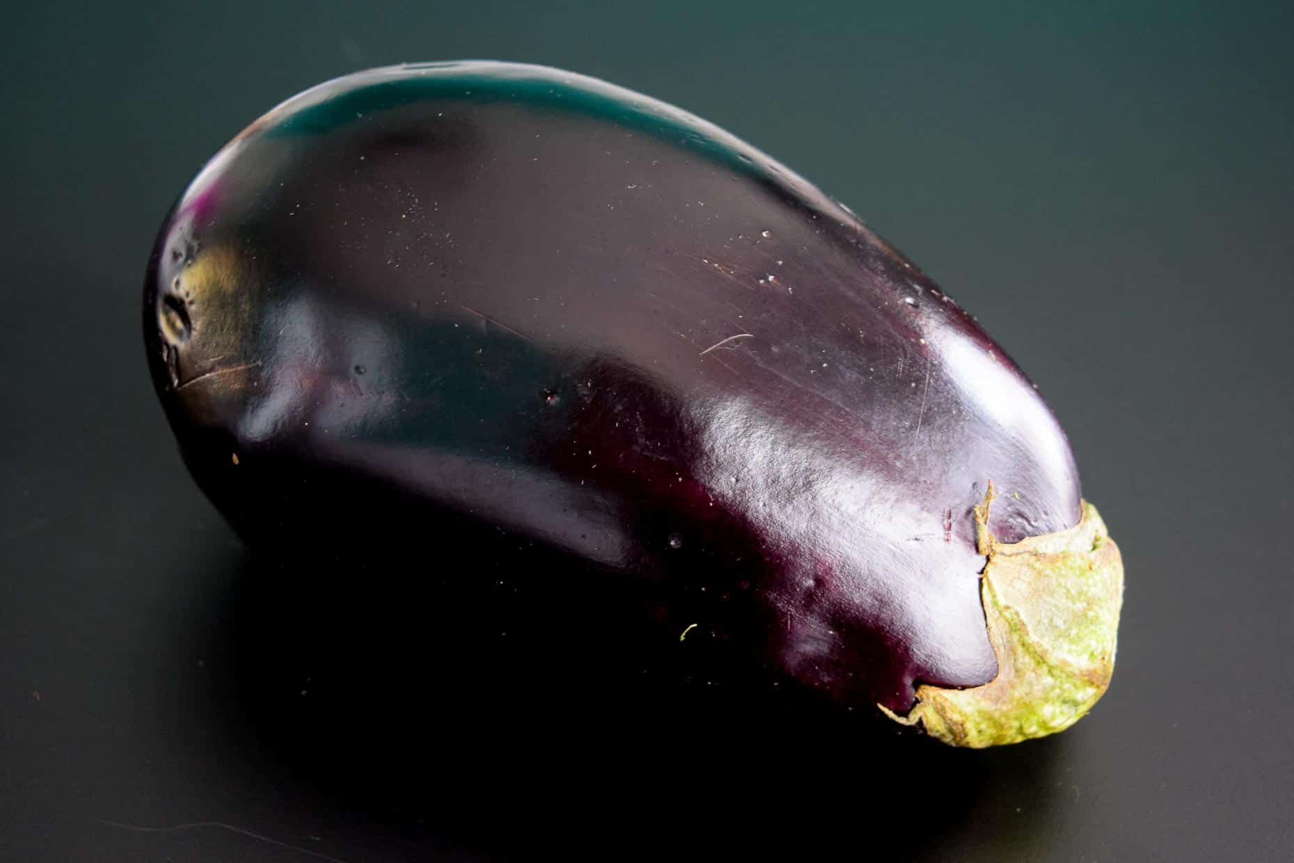 Eggplant on black background 