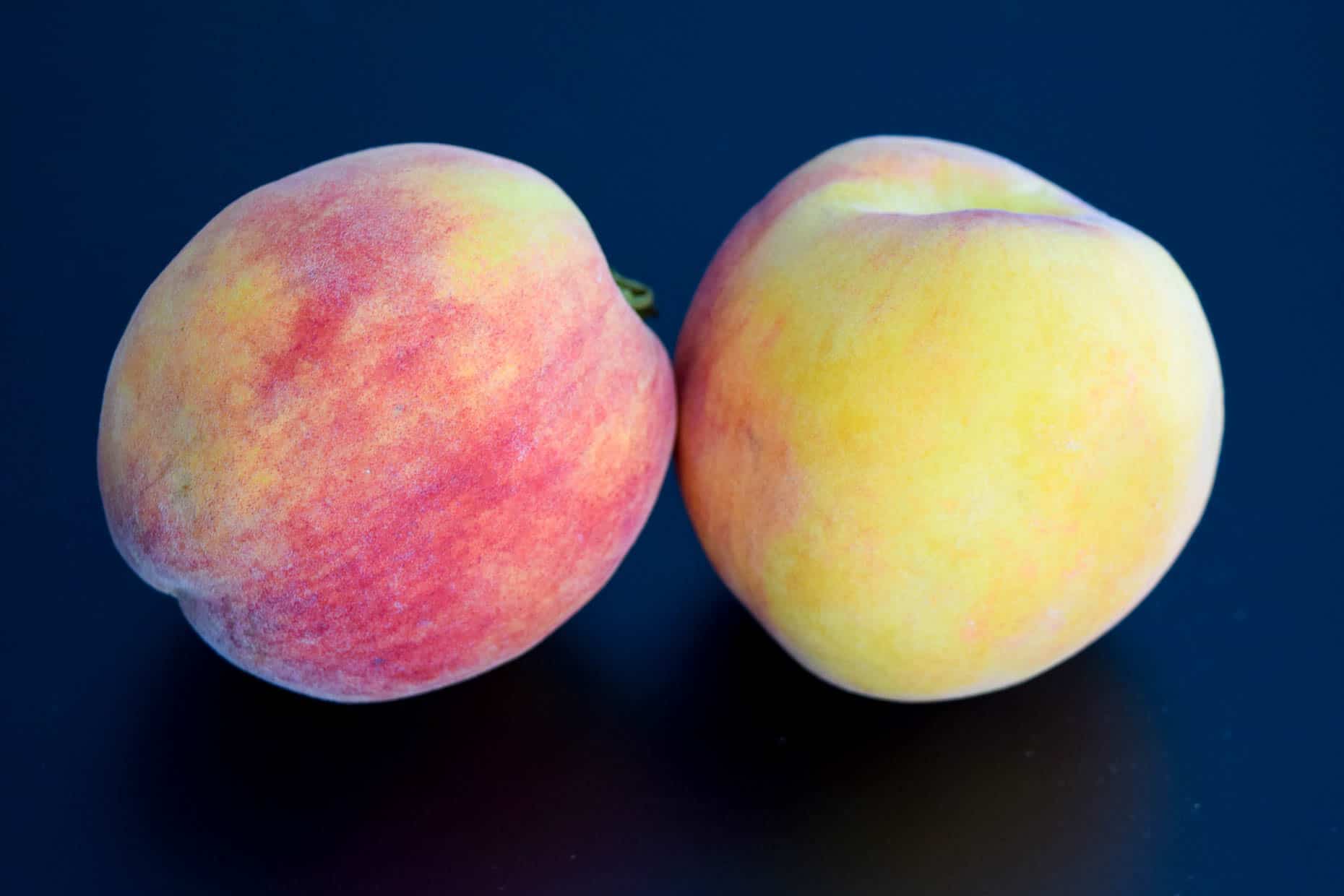 Peaches on black background