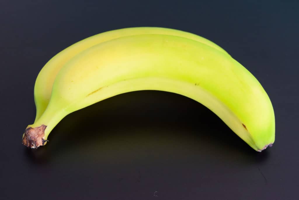 a banana on black background