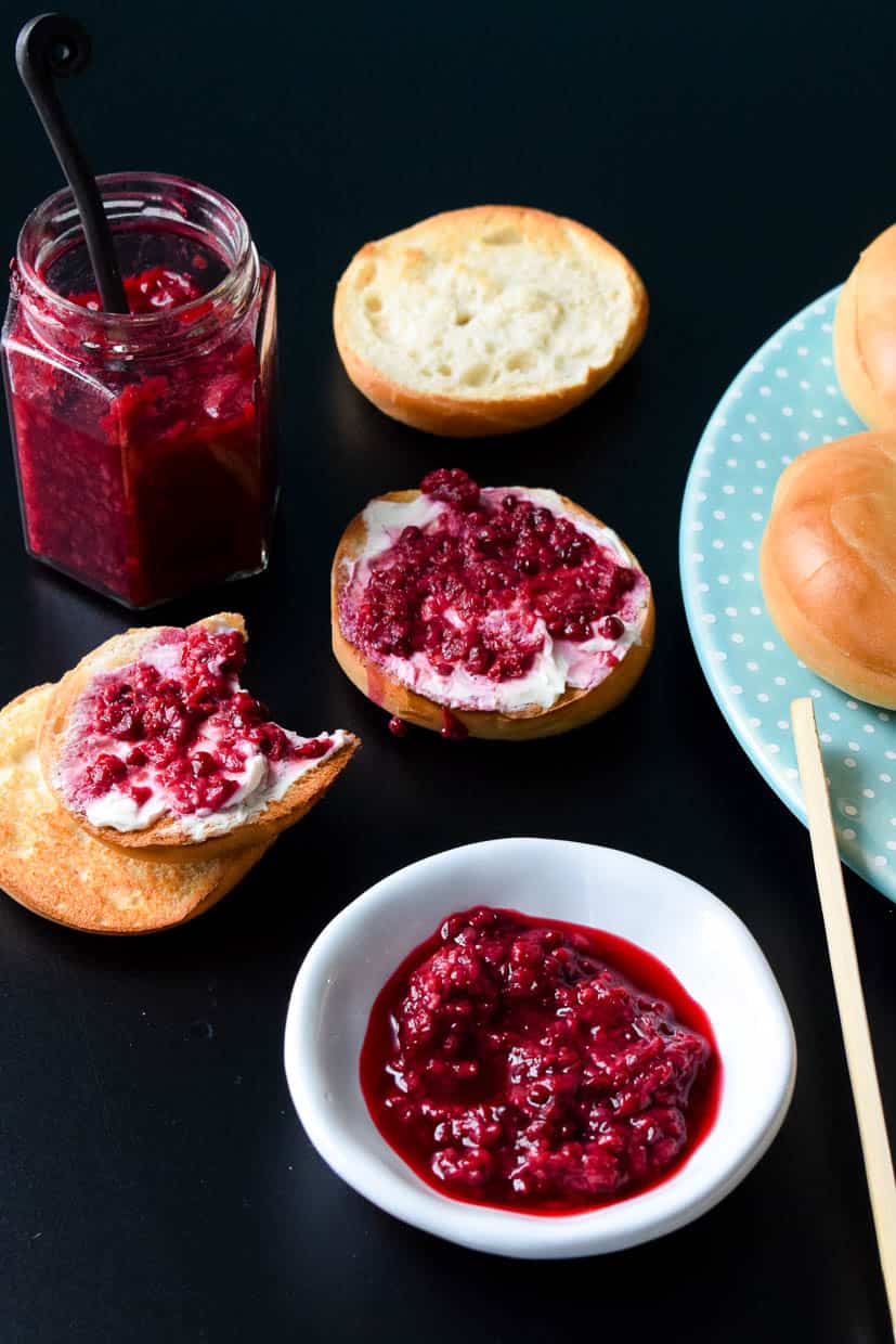Fresh Mixed Berry Compote in white bowl with mini bagels 