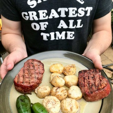 Smoked scallops with steak and jalapeños on plate ready to be served