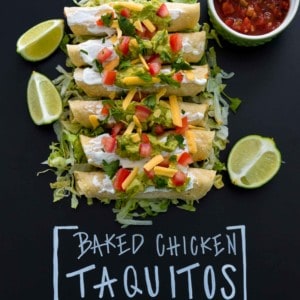 Baked chicken taquitos on bed of shredded lettuce with title written on black background