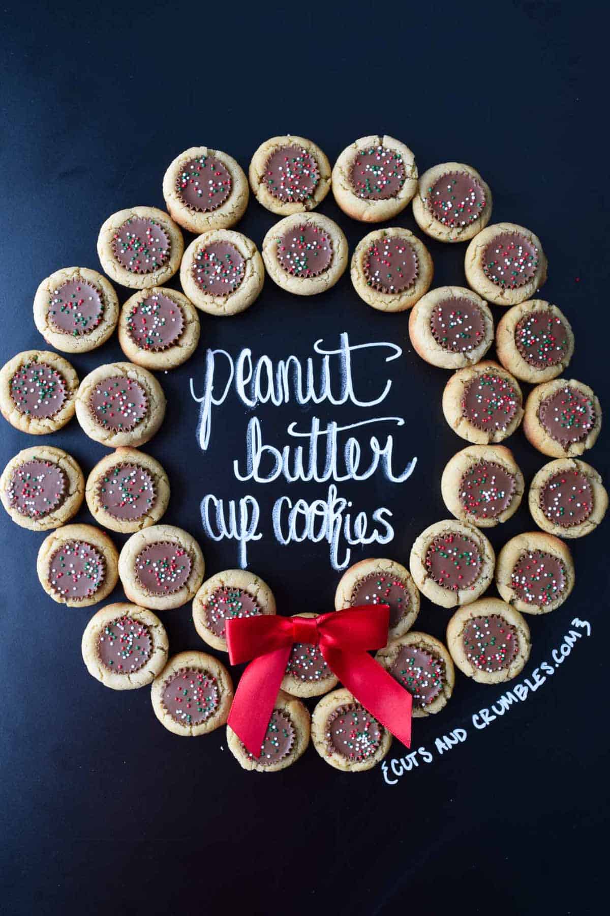 peanut butter cup cookies placed in shape of a wreath with title written on chalkboard
