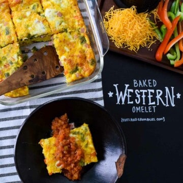 baked western omelet served in rustic black bowl